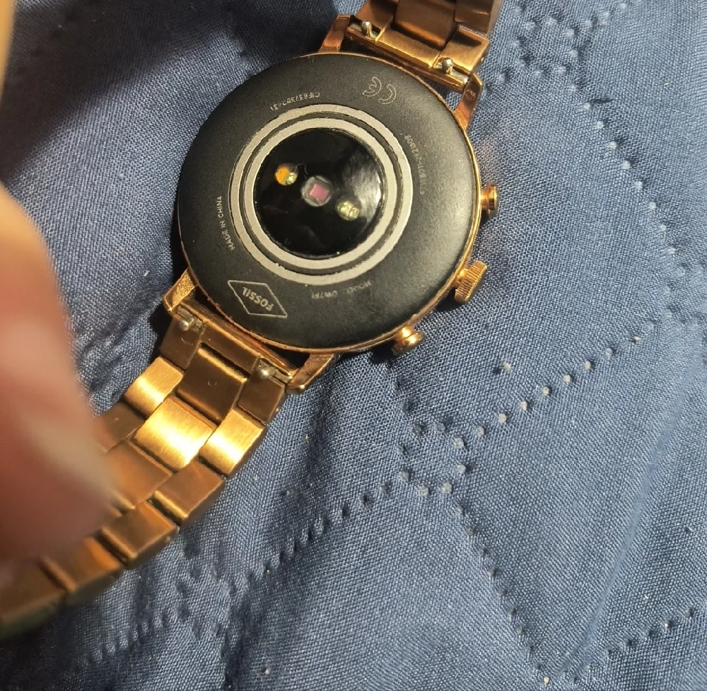 Gold Smartwatch with Black Charging Cable